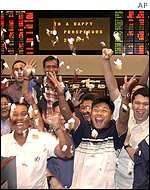 Frankfurt trader dressing up for the carnival, 12 February 2002