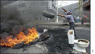 Protestor burning a tyre