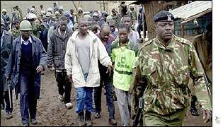 Police leading away suspects