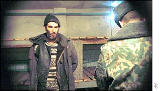 A man is interrogated in a filtration camp in the Chechen village of Chernokozovo, northwest of Groznyy. Allegations of torture at the camp were denied.