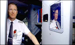 Virgin Atlantic Airways Captain Ian Belmore shows a new reinforced cockpit door 
