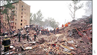 Firefighters searching the scene of a Moscow apartment block blast 