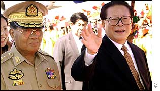 Jiang Zemin (R) visits Rangoon December 2001. 