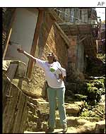 A health worker distributes information leaflets in a shanty town in Rio