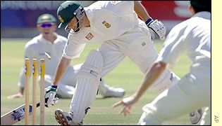 South African batsman Neil McKenzie is run out by a direct hit on the stumps by Australian fielder Damien Martyn