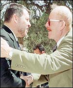 Jordan's King Abdullah II (left) and Iraqi's envoy Izzat Ibrahim during the talks in Amman