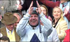 Dean Gallagher celebrates winning the Champion Hurdle on Hor La Loi 