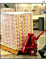 A stack of newly-printed currency