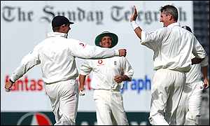 Andrew Caddick celebrates one of his three morning-session wickets 