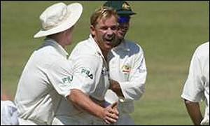 Shane Warne celebrates one of four wickets on the second day 