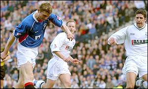 Ranger's Tore Andre Flo scores the opening goal of the match