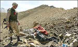 US soldier looks over a bombed out al-Qaeda position 