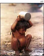 A malnourished child taking bath