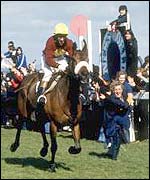Red Rum wins his third Grand National to great applause in 1977
