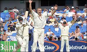 Andrew Flintoff takes the wicket of Chris Harris shortly before bad light ended play