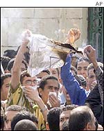 Egyptian students burn a representation of an Israeli flag at a demonstration in Cairo