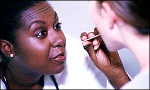 A doctor examines a patient