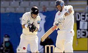 England captain Nasser Hussain plays a late cut-shot to score four more runs 