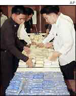 Narcotics officers with drugs haul