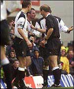 Jamie Carragher is dismissed for throwing a coin into the crowd