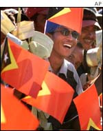 East Timorese wave the new national flag 