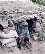 A Kashmiri comes out of a trench during a lull in cross border shelling between India and Pakistan