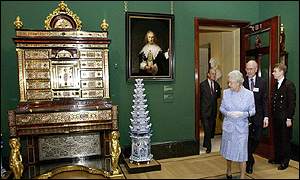 The Queen inspects a recently restored Rembrandt and a Boulle secretaire