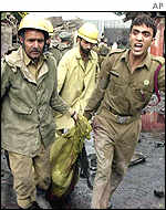 Soldiers carry a body