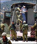 Israeli troops with detainees outside Salfit