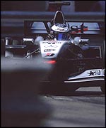 Mika Hakkinen threads his way through the barriers in 2001