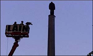 David Blaine standing on column in evening