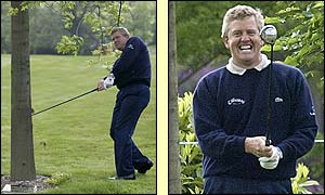 Britain's Colin Montgomerie hits a miraculous three-wood from the rough at the opening hole