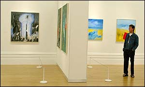 Sir Paul McCartney views his own paintings