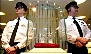 Guards watching over a pair of platinum and diamond-encrusted shoes