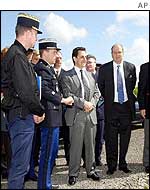 French Interior and Security Minister Nicolas Sarkozy (centre)