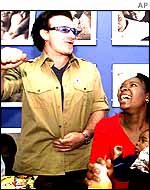 Bono with 11-month-old Thomas Quibile and his mother Mpumelelo at the Soweto hospital