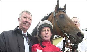 Sir Alex Ferguson, Mick Kinane and Rock of Gibraltar after their victory in the Irish 2,000 Guineas