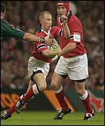 Munster's Peter Stringer attempts to break through