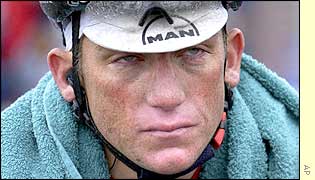 Tyler Hamilton of the Tiscali team does not enjoy the wet conditions