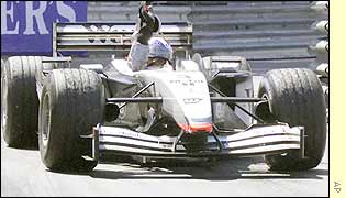 David Coulthard salutes the Monaco crowd as he completes his lap of honour