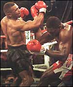 Mike Tyson batters Frank Bruno against the ropes in 1996