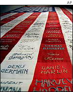 A quilt fashioned after a US flag bears the names of 346 firefighters who died 11 September