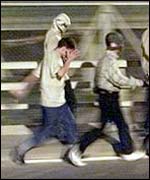 Illegal migrants trying to enter the tunnel