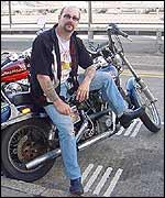 Snob outside his workshop