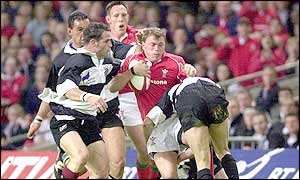 Percy Montgomery who will play his club rugby in Wales hits Craig Morgan