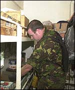 File picture showing a member of HMS Portland carrying out a search