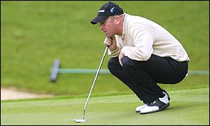 England's Gary Evans lines up a putt at the 17th