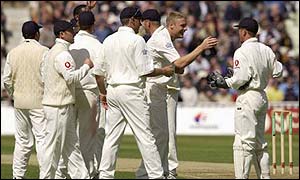 Andrew Flintoff congratulates wicket-keeper Alec Stewart after the pair combined to dismiss Kumar Sangakkara