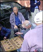 Men playing a board game