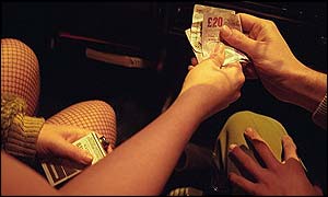 Money being handed to a prostitute